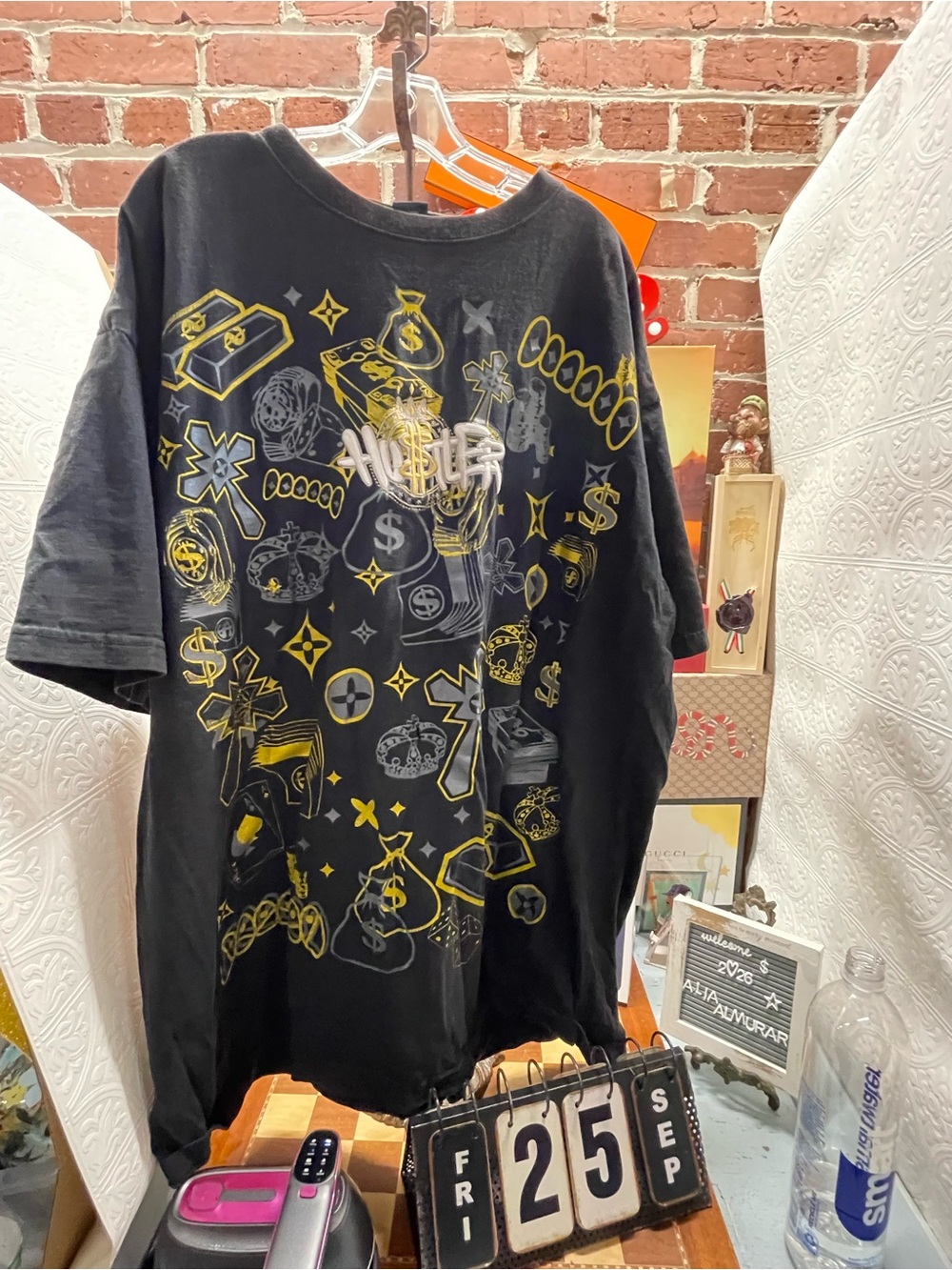 vintage black graphic t-shirt featuring an all-over gold-and-silver money,